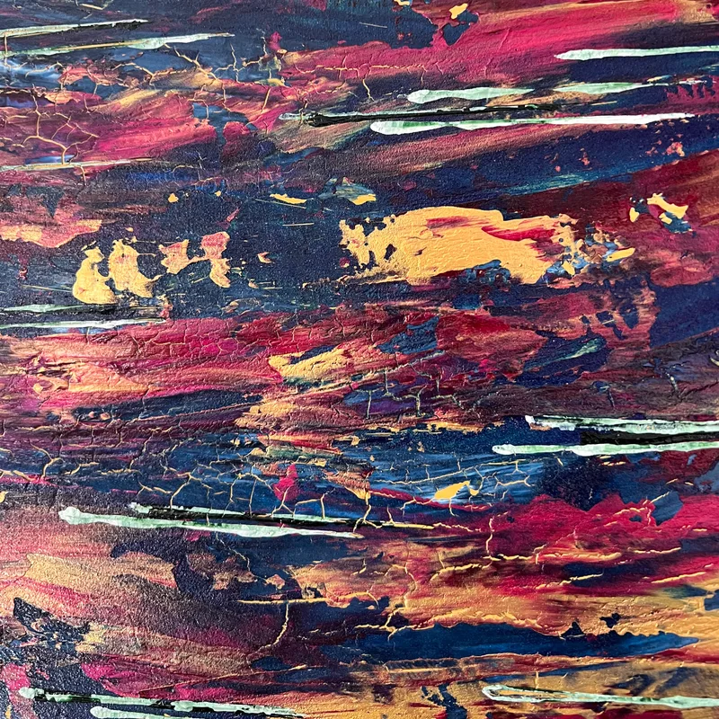A close-up of abstract artwork with burgundy and gold strokes.