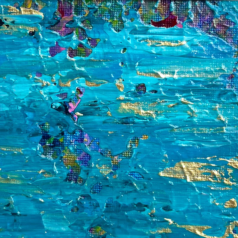 A close-up of abstract artwork in turquoise with gold details.