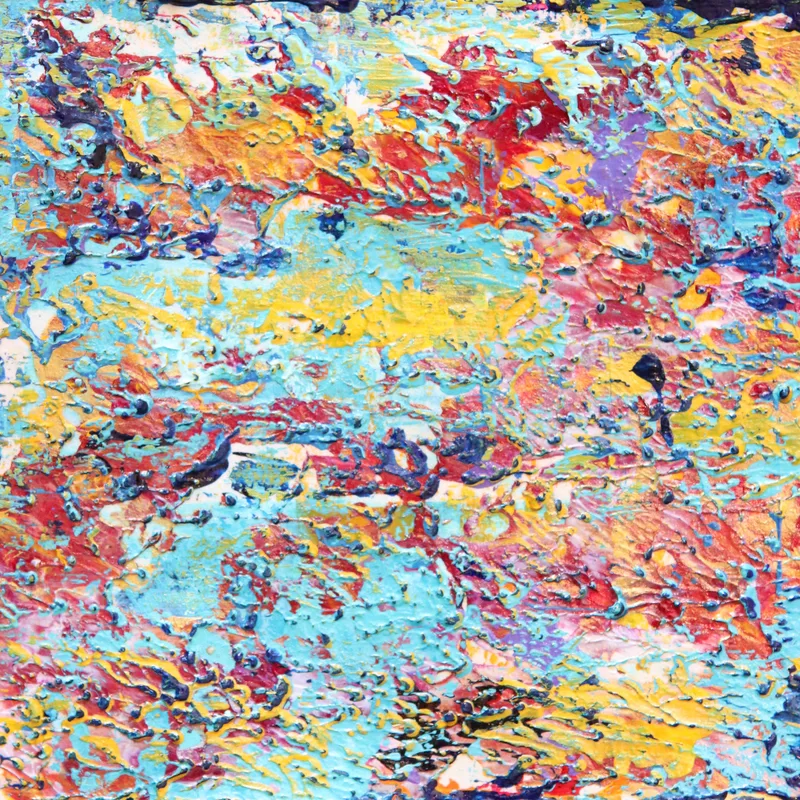 A close-up of abstract artwork in turquoise and coral.