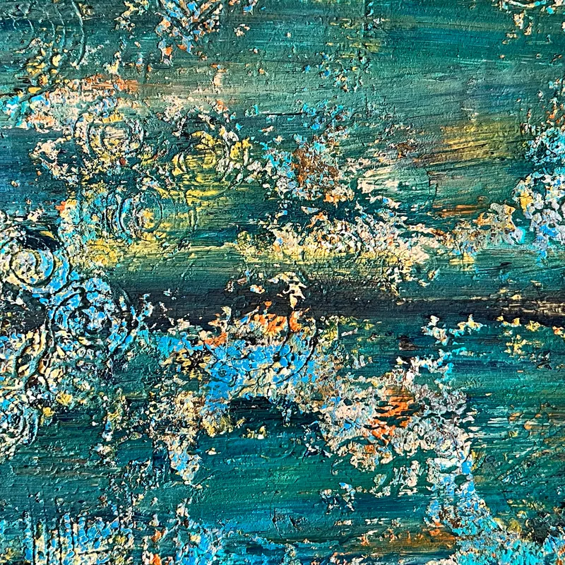 A close-up of abstract artwork in teal and blue.
