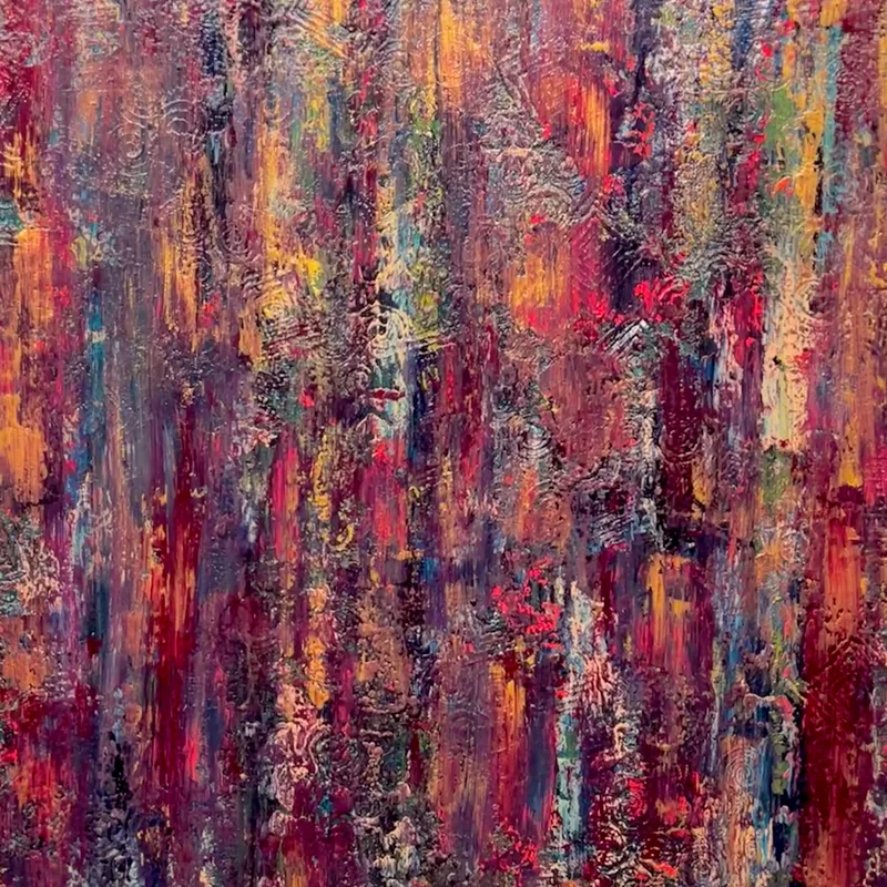A close-up of abstract artwork in burgundy and purple.